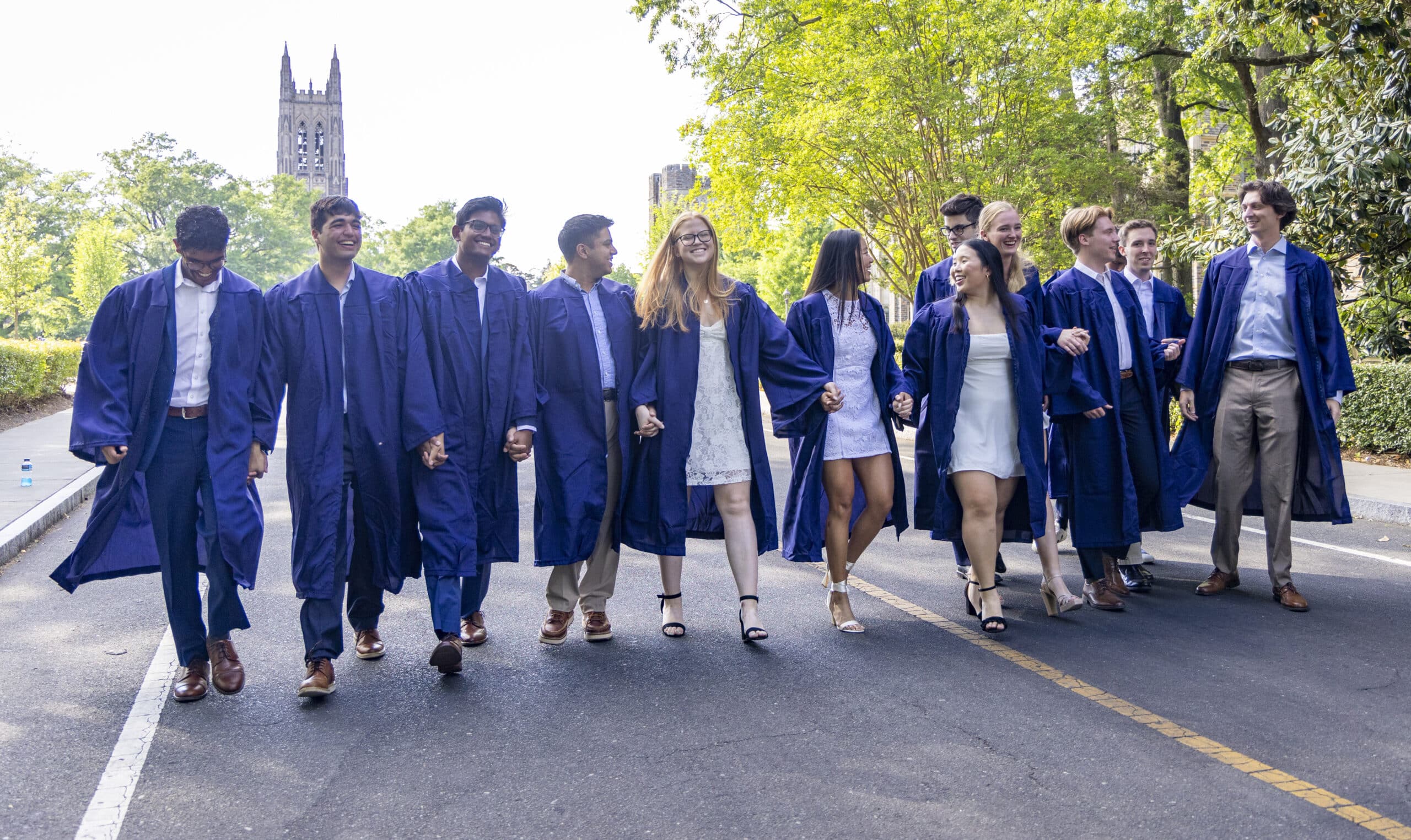 Trinity College of Arts & Sciences and Pratt School of Engineering students pose for graduation photos on Chapel Drive.