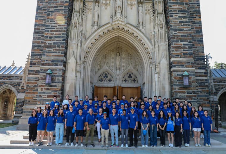 The incoming class of FinTech Students in front of the Duke Chapel