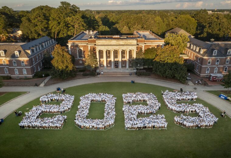 aerial view of a crowd arranged into figures 2 0 2 5